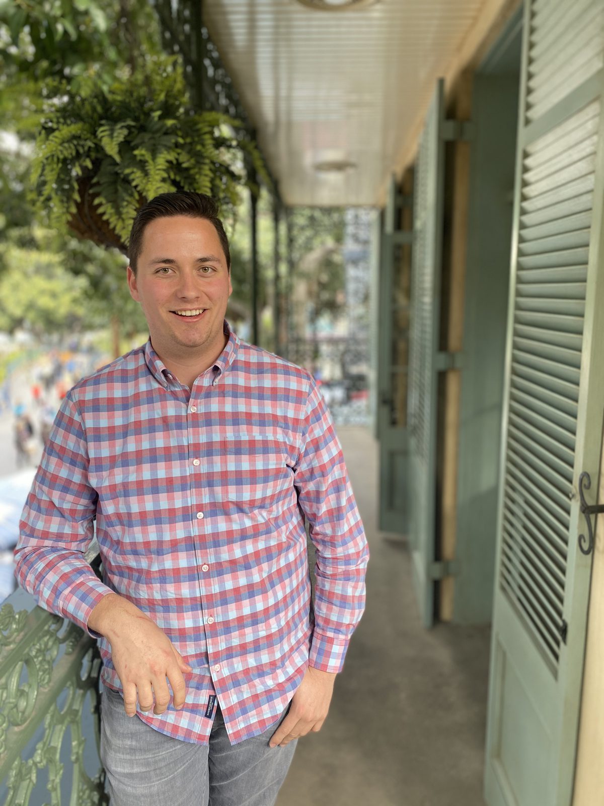 Chandler Warne smiling on a balcony at Disneyland